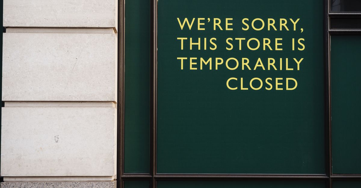 A photo of a store facade with a sign indicating temporary closure due to unforeseen circumstances.