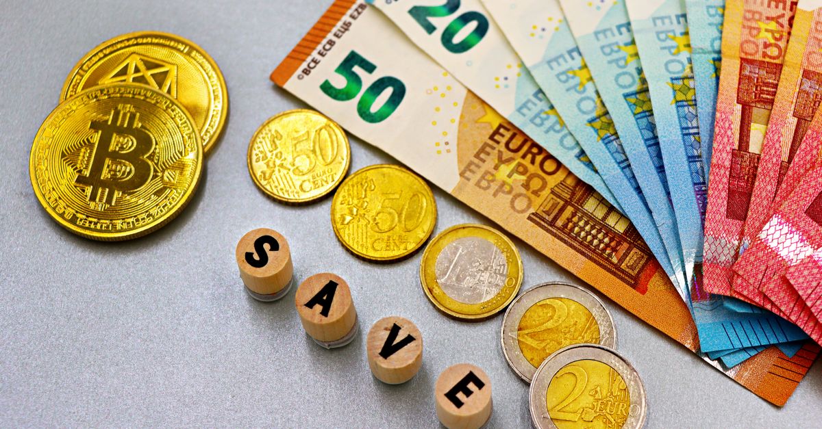 Euro banknotes and Bitcoin coins arranged with 'save' text for finance concept.