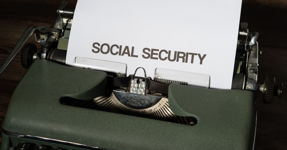 Close-up of a vintage typewriter typing 'SOCIAL SECURITY' on paper, classic concept.